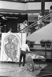Painter and his artwork at Governor's Square Mall - Tallahassee, Florida.