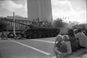 Spectators watch a tank at the Veterans Day Parade - Tallahassee, Florida.