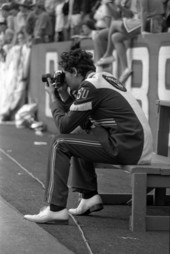 Member of FSU's Marching Chiefs with a camera - Gainesville, Florida.