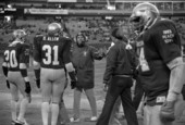Football player, Billy Allen # 31 and Roosevelt Snipes # 20 with other players and coaches - Tallahassee, Florida.