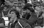 Spectators at FSU football game adjusting headband - Tallahassee, Florida.