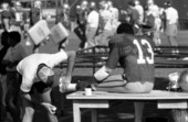 Football player, Kim Mack gets his foot bandaged - Tallahassee, Florida.