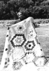 Betsy (Mrs. Denard) Webb with one of her quilts in White Springs, Florida.
