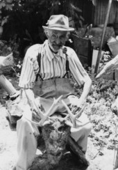 Portrait of sculptor Jesse J. Aaron with one of his works in Gainesville, Florida.