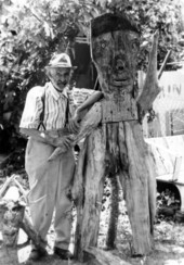 Sculptor Jesse J. Aaron standing with one of his works in Gainesville, Florida.