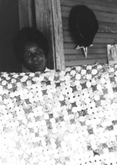 Portrait of Queenie Udell with one of her yo-yo quilts in White Springs, Florida.