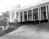 Banjoist Abner Jay in front of his restaurant in White Springs, Florida.