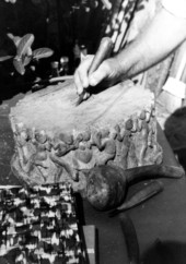 John Albert carving a piece of wood- Tampa, Florida.