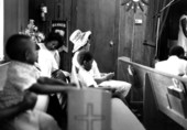 People sitting in the pews at St. Johns Missionary Baptist Church- Seville, Florida