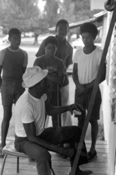 Moses Williams playing the diddley bow for a group of boys- Waverly, Florida