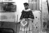 Bert Billie holding a couple of her baskets - Big Cypress Seminole Indian Reservation, Florida