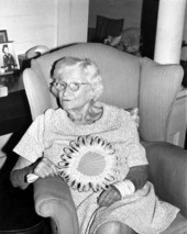 Jean Waldron holding hand fan she made of palmetto - White Springs, Florida