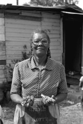 Jesse Mae Newsome holding sassafras root - White Springs, Florida