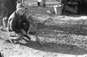 Lloyd Earl McMullian on his farm with old one-mule plow - Two Egg, Florida