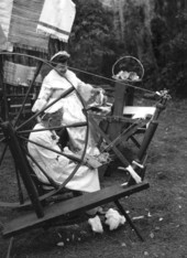 Jessie Coker spinning cotton while Eueline Jordan weaves- White Springs, Florida