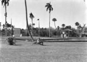 Visitor in front of the Barron Collier Memorial and blockhouse visitor center at Collier-Seminole State Park - Collier County, Florida