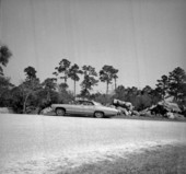 Visitor in car at Koreshan Historic State Park - Estero, Florida