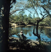 Park visitor fishing in the Estero River at Koreshan State Park - Estero, Florida