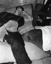 Young man sleeping with manatee