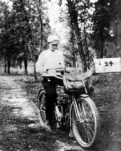 Rural mail carrier Claude G. Varn on a Harley Davidson motorcycle in Bartow, Florida.
