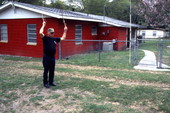 Whipmaker Ernest "Shelby" Braddock cracking a couple handmade cow whips at his home in De Land, Florida.