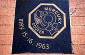 Close-up view showing Mercury 9 mission logo carved in black granite at Space View Park near the U.S. Space Walk of Fame Museum in Titusville, Florida.