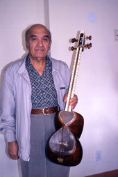 Professor Attah Kassari with an Iranian Tar lute in Clearwater, Florida.