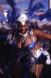Close-up view of a costumed participant in the Caribbean Carnival parade at the Homestead Racetrack.