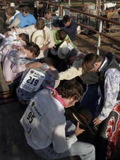 Prayer session during the Williston High School rodeo.