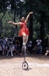 Lijun Nang, Chinese acrobat and her unicycle at the Florida Folklife Festival - White Springs, Florida.
