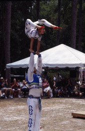 Xuefei Leng hold Dan Dan Zhao in the air at the Florida Folklife Festival - White Springs, Florida.