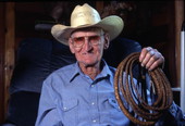 Cow whip maker George "Junior" Mills and a whip - Basinger, Florida.
