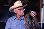 Cow whip maker George "Junior" Mills and a whip - Basinger, Florida.