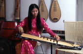 Tina Nguyen, Vietnamese musician with a Dan Bau - Orlando, Florida.