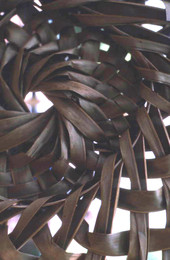 Looking at the weaves of an object at the Florida Folk Festival - White Springs, Florida