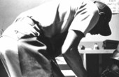 Frank Mitchell repairing a shoe at Capells Shoe Store - Lake City, Florida