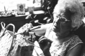 Pearlie Gates weaving a palmetto basket