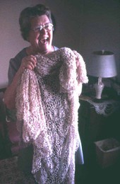 Mildred Rivers holding up an example of her tatting- Lake Butler, Florida