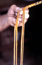 Claude Sheppard braiding a whip - Gainesville, Florida.