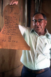 Whip maker Claude Sheppard holding up motivational poem - Gainesville, Florida.