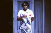 Mrs. Scunions holding a corn husk mop model - Miami, Florida.
