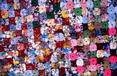 Close up view of a yo-yo quilt made by Queenie Udell- White Springs, Florida