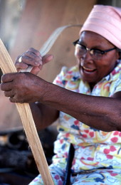 Lucreaty Clark peeling strips of white oak to make baskets