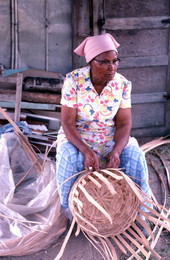 Lucreaty Clark weaving a white oak basket