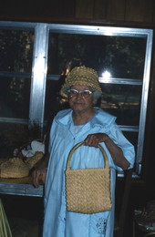 Pearlie Gates holding a handbag she made