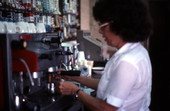 Cuban American woman preparing a cup of coffee at Cafe Cubano in Little Havana - Miami, Florida.