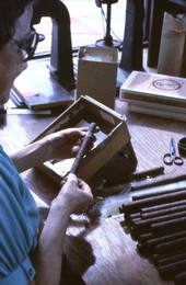 Mrs. Rafael Martinez putting labels on cigars in Little Havana - Miami, Florida.