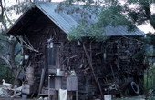 Old wine bar now used to display agricultural tools - White Springs, Florida.
