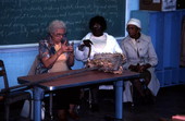 Ladies from the Golden Age project demonstrating and discussing corn shuck scrubber - Lake City, Florida.