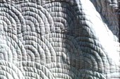 Close up view of quilting pattern and stitching from quilt made by Grace Scaff - White Springs, Florida.